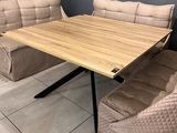 a couch and a table in a room with blue walls