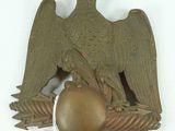 an eagle that is sitting on top of a ball