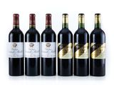 six bouteilles de vin alignées sur une surface blanche