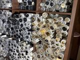 many rolls of fabric on the shelves in the store