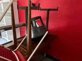 a picture of a red room with a computer on a desk