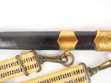a close up of a pair of belts on a white surface