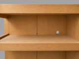 a wooden shelf that has a small hole in it