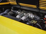 a close up of a yellow car with its hood open