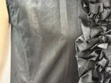 a close up of a dress with ruffles on it