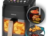 a close up of an air fryer with food inside of it