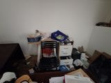 a cluttered room with a lot of clutter on the floor