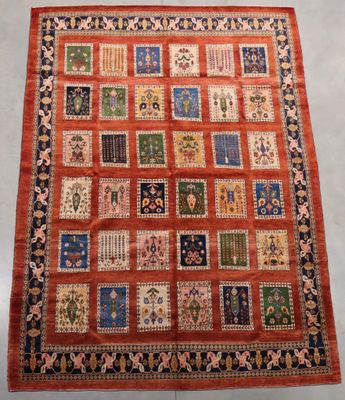 an orange and blue rug with a patchwork design on it