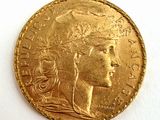 l'image d'une pièce d'or sur laquelle figure une tête de femme