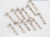 a lot of silver spoons that are on a table