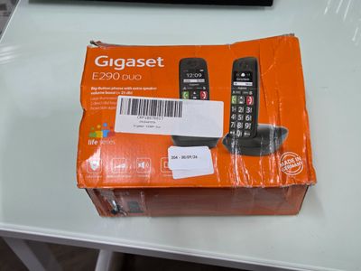 a box that has a cell phone in it on a table