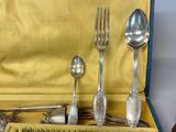 a box with silverware in it and a fork, spoon, spoon and spoon rest in it