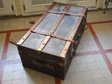 an old suitcase sitting on the floor in a room