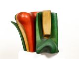 a sculpture of a vase with a bunch of vegetables inside of it