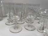a lot of empty wine glasses sitting on a table