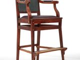 an image of a wooden chair with a black leather seat