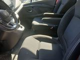the interior of a car with black seats and red trims