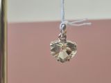 a small crystal ball hanging from a string