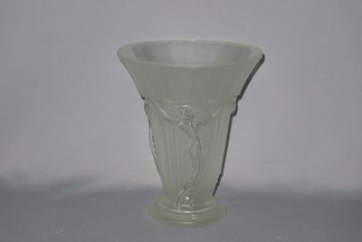 a glass vase that is sitting on a table