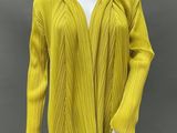 an image of a mannequin wearing a yellow sweater and black pants