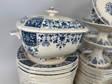 many plates and bowls stacked on top of each other