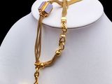 gold plated necklace with purple glass beads and a gold chain