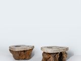 two pieces of wood sitting next to each other on a white surface
