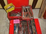 many tools in a red box on the floor