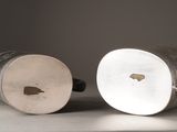 two cups that are sitting on a table
