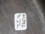 a sticker on the side of a metal pan with writing on it