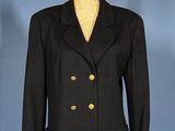 a black jacket with gold buttons on a mannequin mannequin