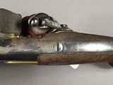 a gun that is on display on the wall