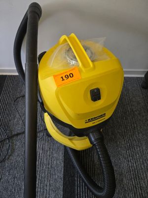 a yellow vacuum that is sitting on the floor