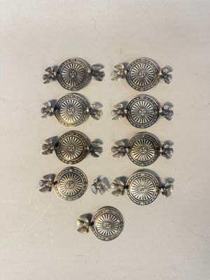 six antique silver plated turtle knobs on a white surface