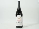 a bottle of wine that is sitting on a table