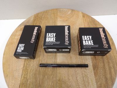 three boxes of easy bake on a wooden table with a pencil