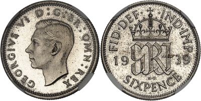 a close up of a coin with a man ' s head on it