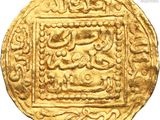 a close up of a gold coin on a white background