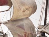 a model of a pirate ship on display in a museum
