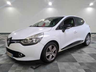 the white car is parked on a checkered tile floor