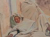 a painting of a woman laying on the ground