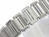 a close up of a watch bracelet on a white surface