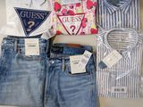 a lot of clothes that are sitting on a table