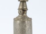 a silver lamp with a white glass shade on top of it