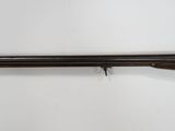 a rifle with a wooden barrel on a white background