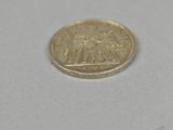 a small coin that is sitting on a table