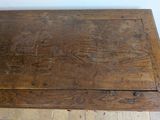 a wooden table with a drawer on top of it