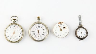 four different types of pocket watches are displayed on a white surface