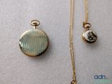 two necklaces with a picture of a woman on them