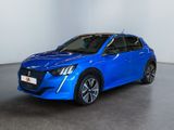 a blue car in a white room with a black floor